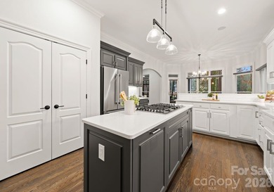 Set on a level one-acre lot on the 5th hole of Trump National on Trump National Golf Club Charlotte in North Carolina - for sale on GolfHomes.com, golf home, golf lot