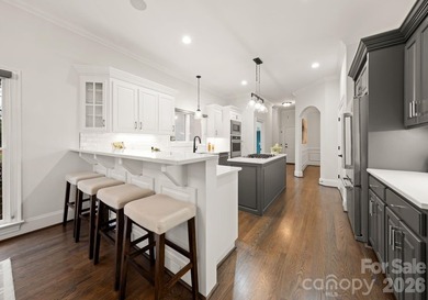 Set on a level one-acre lot on the 5th hole of Trump National on Trump National Golf Club Charlotte in North Carolina - for sale on GolfHomes.com, golf home, golf lot