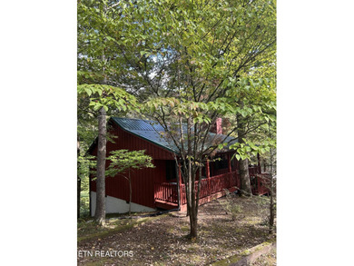 Discover your perfect escape in the heart of Townsend, Tennessee on Laurel Valley Golf Course in Tennessee - for sale on GolfHomes.com, golf home, golf lot