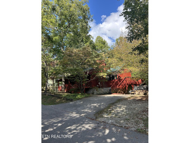 Discover your perfect escape in the heart of Townsend, Tennessee on Laurel Valley Golf Course in Tennessee - for sale on GolfHomes.com, golf home, golf lot