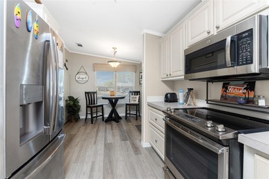 Beautifully Finished Waterfront Home featuring 2 bedrooms and 2 on Kings Gate Golf Club in Florida - for sale on GolfHomes.com, golf home, golf lot