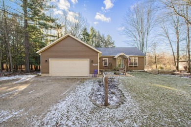 Prepare to fall in love with this captivating 5-bedroom on Canadian Lakes Country Club-The Royal Course in Michigan - for sale on GolfHomes.com, golf home, golf lot