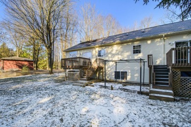 Prepare to fall in love with this captivating 5-bedroom on Canadian Lakes Country Club-The Royal Course in Michigan - for sale on GolfHomes.com, golf home, golf lot