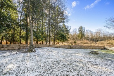 Prepare to fall in love with this captivating 5-bedroom on Canadian Lakes Country Club-The Royal Course in Michigan - for sale on GolfHomes.com, golf home, golf lot