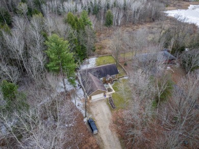 Prepare to fall in love with this captivating 5-bedroom on Canadian Lakes Country Club-The Royal Course in Michigan - for sale on GolfHomes.com, golf home, golf lot