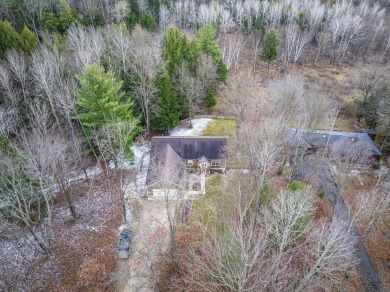 Prepare to fall in love with this captivating 5-bedroom on Canadian Lakes Country Club-The Royal Course in Michigan - for sale on GolfHomes.com, golf home, golf lot