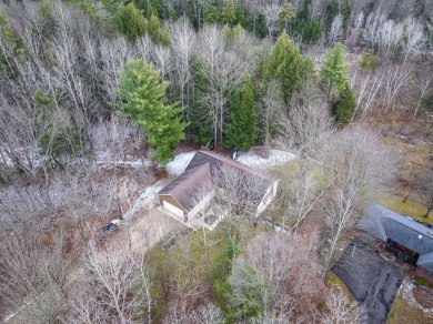 Prepare to fall in love with this captivating 5-bedroom on Canadian Lakes Country Club-The Royal Course in Michigan - for sale on GolfHomes.com, golf home, golf lot