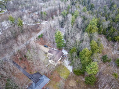 Prepare to fall in love with this captivating 5-bedroom on Canadian Lakes Country Club-The Royal Course in Michigan - for sale on GolfHomes.com, golf home, golf lot