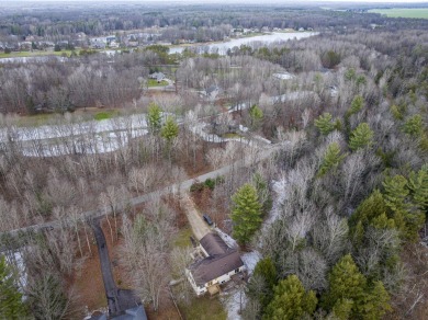 Prepare to fall in love with this captivating 5-bedroom on Canadian Lakes Country Club-The Royal Course in Michigan - for sale on GolfHomes.com, golf home, golf lot