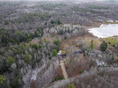 Prepare to fall in love with this captivating 5-bedroom on Canadian Lakes Country Club-The Royal Course in Michigan - for sale on GolfHomes.com, golf home, golf lot