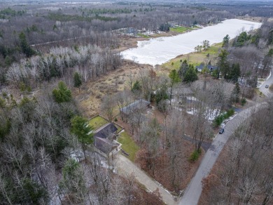 Prepare to fall in love with this captivating 5-bedroom on Canadian Lakes Country Club-The Royal Course in Michigan - for sale on GolfHomes.com, golf home, golf lot