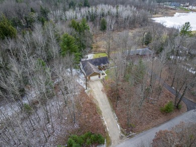 Prepare to fall in love with this captivating 5-bedroom on Canadian Lakes Country Club-The Royal Course in Michigan - for sale on GolfHomes.com, golf home, golf lot