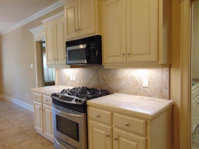 Spacious home that features 4 bedrooms & 2 1/2 baths, Tile in on The Country Club of Arkansas in Arkansas - for sale on GolfHomes.com, golf home, golf lot