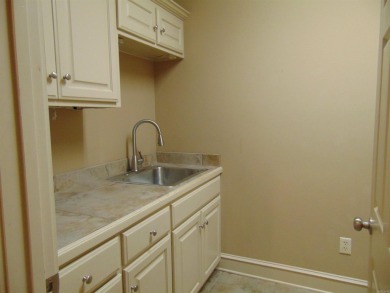 Spacious home that features 4 bedrooms & 2 1/2 baths, Tile in on The Country Club of Arkansas in Arkansas - for sale on GolfHomes.com, golf home, golf lot