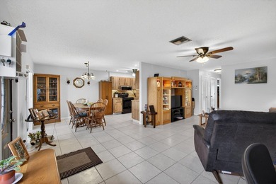 Beautiful one-story villa located in a desirable 24-hour manned on Cypress Lakes Golf Course - West Palm Beach in Florida - for sale on GolfHomes.com, golf home, golf lot