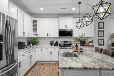 Welcome to this spacious 4-bedroom, 3.5-bath townhouse perfectly on The Westham Golf Club At Magnolia Green in Virginia - for sale on GolfHomes.com, golf home, golf lot