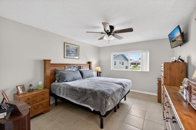 Beautiful one-story villa located in a desirable 24-hour manned on Cypress Lakes Golf Course - West Palm Beach in Florida - for sale on GolfHomes.com, golf home, golf lot