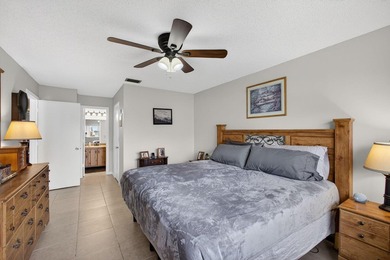 Beautiful one-story villa located in a desirable 24-hour manned on Cypress Lakes Golf Course - West Palm Beach in Florida - for sale on GolfHomes.com, golf home, golf lot