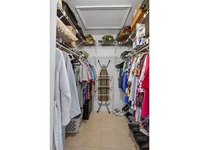 Beautiful one-story villa located in a desirable 24-hour manned on Cypress Lakes Golf Course - West Palm Beach in Florida - for sale on GolfHomes.com, golf home, golf lot