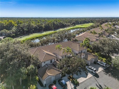 Step into this pristine second-floor coach home in Pelican Sound on  in Florida - for sale on GolfHomes.com, golf home, golf lot