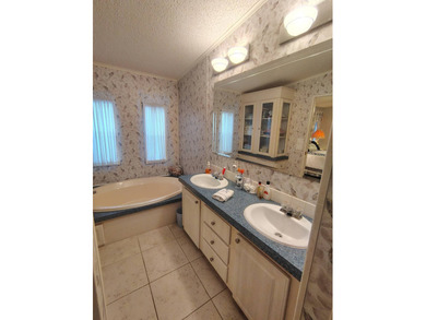 Welcome to this 3-bedroom 2-bath oasis!!! Lot Rent includes all on Spanish Lakes Fairways in Florida - for sale on GolfHomes.com, golf home, golf lot