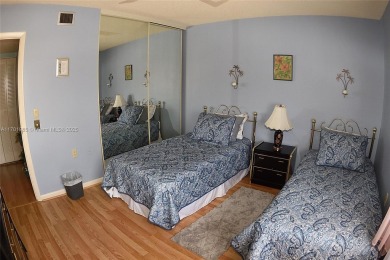 Price Improvement on this spacious top floor 2 bedroom condo in on The Country Club At Boca Raton in Florida - for sale on GolfHomes.com, golf home, golf lot