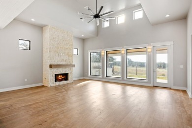 NEW CONSTRUCTION BY HILL COUNTRY SIGNATURE HOMES sits on garden on The Club At Comanche Trace in Texas - for sale on GolfHomes.com, golf home, golf lot