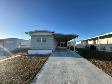 Welcome to Holiday Park! This turn-key furnished LAND-OWNED on Sabal Trace Golf and Country Club in Florida - for sale on GolfHomes.com, golf home, golf lot