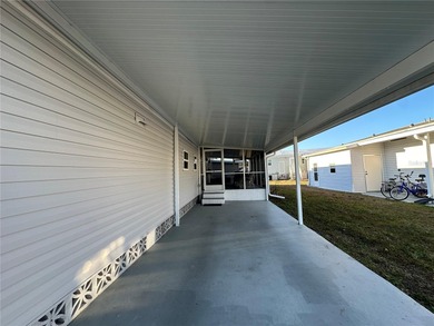 Welcome to Holiday Park! This turn-key furnished LAND-OWNED on Sabal Trace Golf and Country Club in Florida - for sale on GolfHomes.com, golf home, golf lot