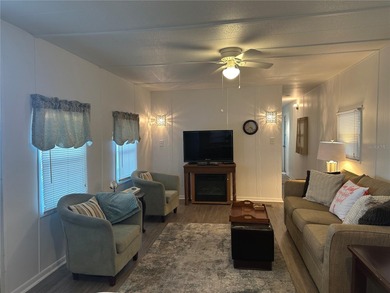 Welcome to Holiday Park! This turn-key furnished LAND-OWNED on Sabal Trace Golf and Country Club in Florida - for sale on GolfHomes.com, golf home, golf lot