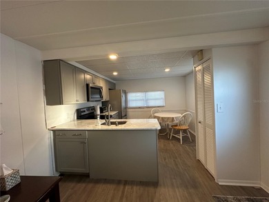 Welcome to Holiday Park! This turn-key furnished LAND-OWNED on Sabal Trace Golf and Country Club in Florida - for sale on GolfHomes.com, golf home, golf lot