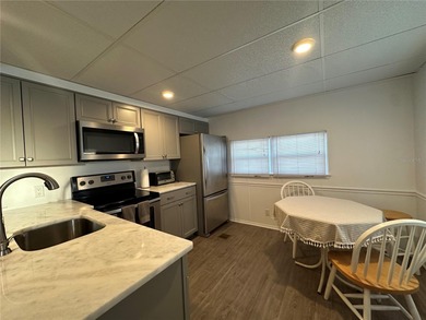 Welcome to Holiday Park! This turn-key furnished LAND-OWNED on Sabal Trace Golf and Country Club in Florida - for sale on GolfHomes.com, golf home, golf lot