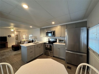 Welcome to Holiday Park! This turn-key furnished LAND-OWNED on Sabal Trace Golf and Country Club in Florida - for sale on GolfHomes.com, golf home, golf lot