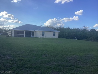 Backyard views like this are rare in Lehigh Acres. Located in a on Mirror Lakes Golf Club in Florida - for sale on GolfHomes.com, golf home, golf lot