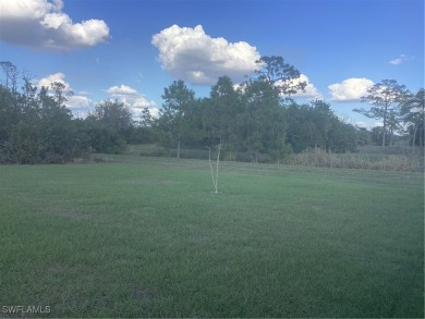 Backyard views like this are rare in Lehigh Acres. Located in a on Mirror Lakes Golf Club in Florida - for sale on GolfHomes.com, golf home, golf lot