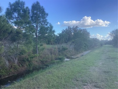 Backyard views like this are rare in Lehigh Acres. Located in a on Mirror Lakes Golf Club in Florida - for sale on GolfHomes.com, golf home, golf lot