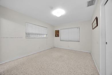 Located on a picturesque, tree lined street in the heart of on Granada Golf Club in Florida - for sale on GolfHomes.com, golf home, golf lot