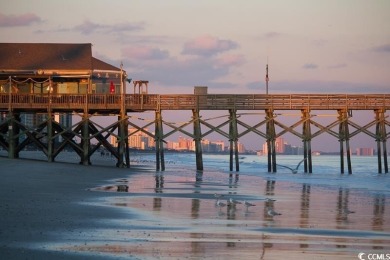 Experience the best of coastal living in this gorgeous top-floor on Myrtlewood Golf Course and Club  in South Carolina - for sale on GolfHomes.com, golf home, golf lot