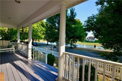 Enjoy a beautiful view of the lake from your large covered front on The Golf Club At Yankee Trace in Ohio - for sale on GolfHomes.com, golf home, golf lot