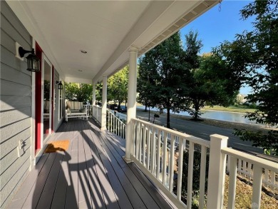 Enjoy a beautiful view of the lake from your large covered front on The Golf Club At Yankee Trace in Ohio - for sale on GolfHomes.com, golf home, golf lot