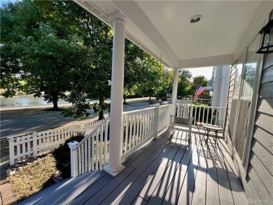 Enjoy a beautiful view of the lake from your large covered front on The Golf Club At Yankee Trace in Ohio - for sale on GolfHomes.com, golf home, golf lot