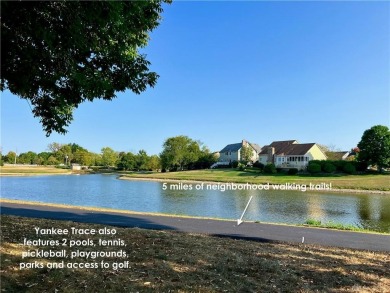 Enjoy a beautiful view of the lake from your large covered front on The Golf Club At Yankee Trace in Ohio - for sale on GolfHomes.com, golf home, golf lot