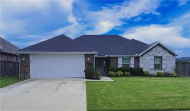 Located in a quiet, family-friendly neighborhood, this home is on Stonebridge Meadows Golf Club in Arkansas - for sale on GolfHomes.com, golf home, golf lot