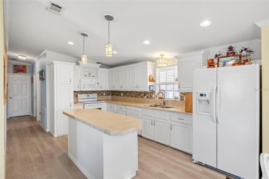 AMAZING VALUE! Fantastic price on this sun-filled, impeccably on Saint Andrews South Golf Club in Florida - for sale on GolfHomes.com, golf home, golf lot