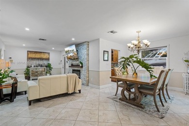 Welcome to your private oasis in the highly sought-after Country on Country Club of Miami in Florida - for sale on GolfHomes.com, golf home, golf lot