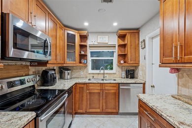 Welcome to your private oasis in the highly sought-after Country on Country Club of Miami in Florida - for sale on GolfHomes.com, golf home, golf lot