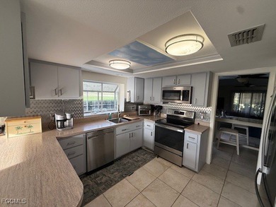 Beautiful 2 bedroom 2 bath, home with private views overlooking on Estero Country Club in Florida - for sale on GolfHomes.com, golf home, golf lot