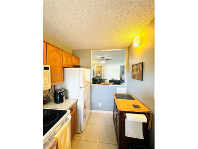 VERY NICE BRIGHT AND CLEAN CONDO IN A 55+ COMMUNITY WITH TILE on Sunrise Lakes Phase III in Florida - for sale on GolfHomes.com, golf home, golf lot
