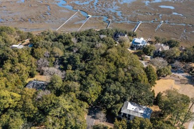 Nestled in the heart of Pawleys Plantation, this private corner on Pawleys Plantation Golf and Country Club in South Carolina - for sale on GolfHomes.com, golf home, golf lot