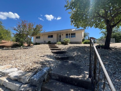 Nicely updated 3/2 brick home perched high for stunning views on Scott Schriener Municipal Golf Course in Texas - for sale on GolfHomes.com, golf home, golf lot